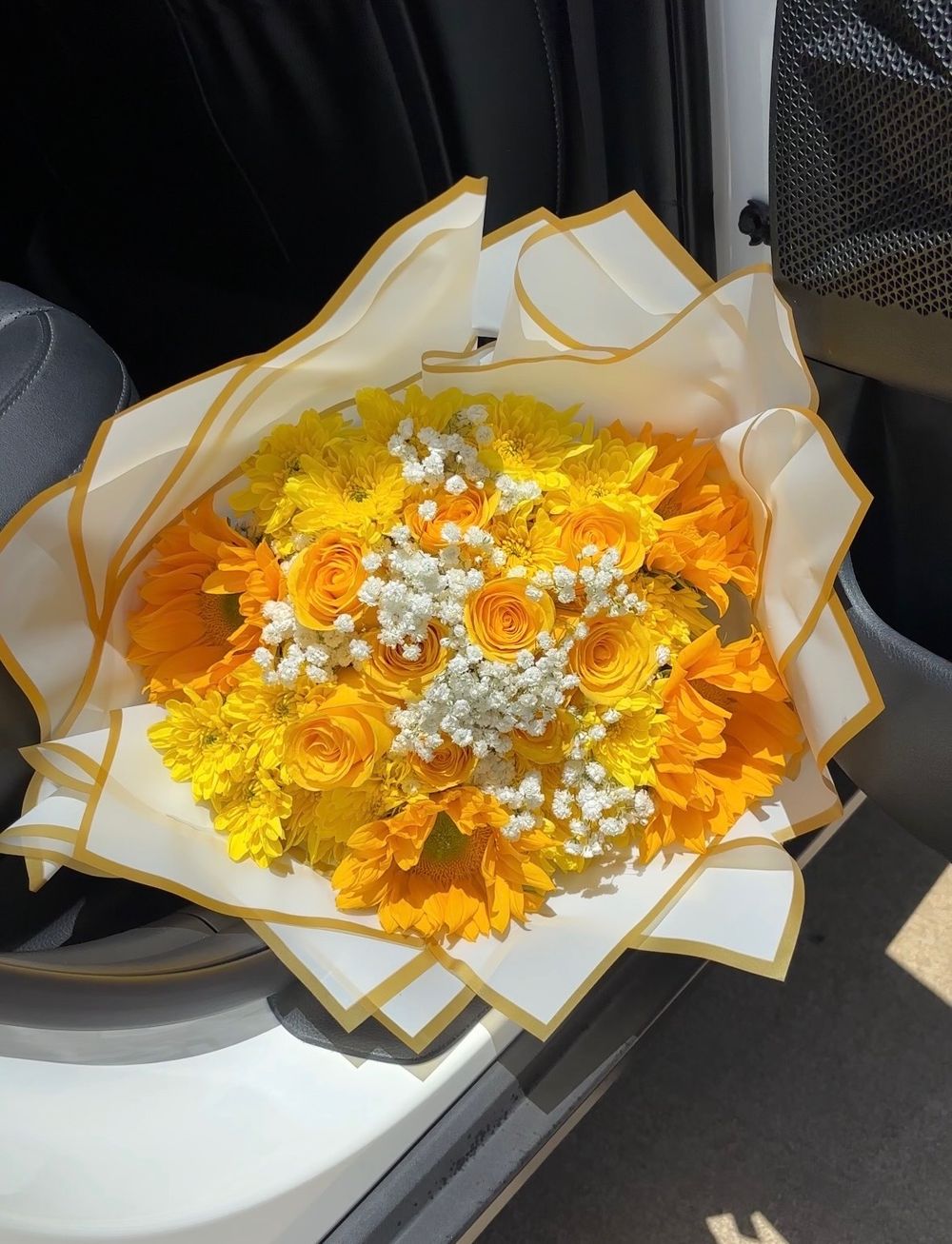 Yellow and orange flower bouquet with baby's breath